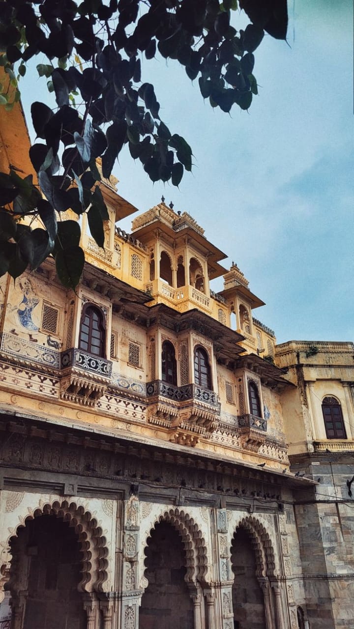 Traditional architectural building with intricate designs under a clear blue sky.